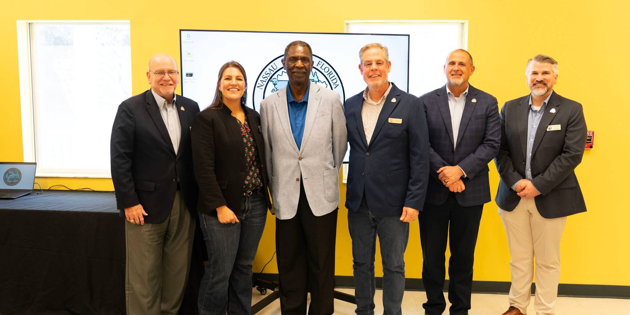 Pictured left to right are: Commissioner John Martin; Commissioner Alyson McCullough; Ervin Gilyard, Chairman of the American Beach Water &amp; Sewer District Advisory Board; Commissioner A.M. "Hupp" Huppmann; Assistant County Manager Marshall Eyerman; and Clerk of Courts Mitch Keiter.
